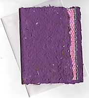 Handmade purple recycled paper with aluminum shavings and silver thread inclusions